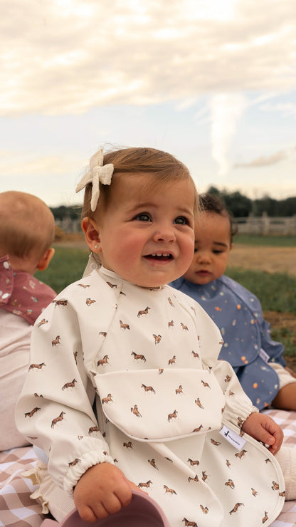 Bavette à manches longues avec pochette intégrée
