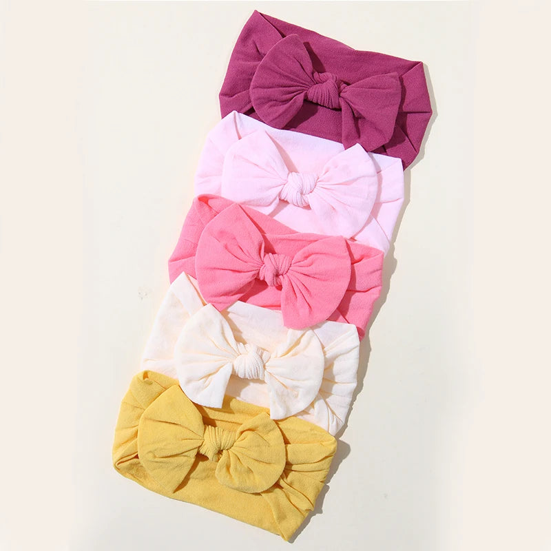 Set of 5 baby headbands with bows – Soft and stretchy nylon (3–36 months)
